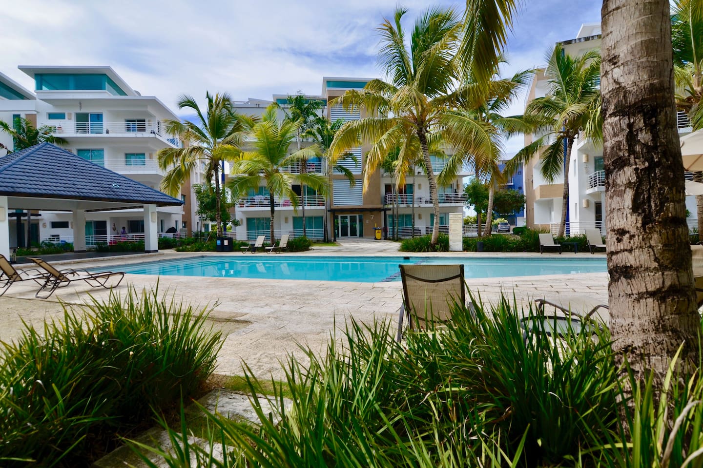 Ample pool area with gazebo and kid's pool.